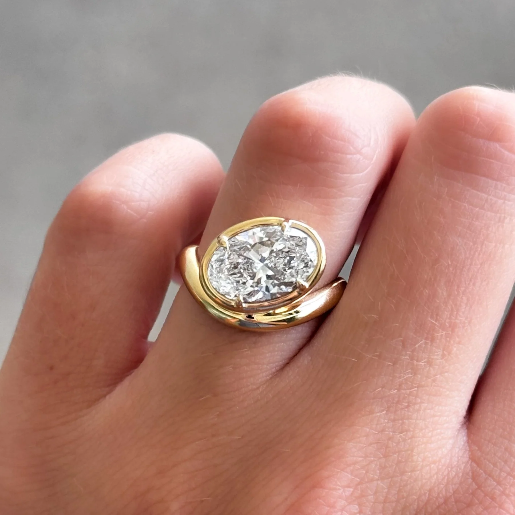 Contoured Club Engagement Ring with an Oval Cut Diamond - Image 6
