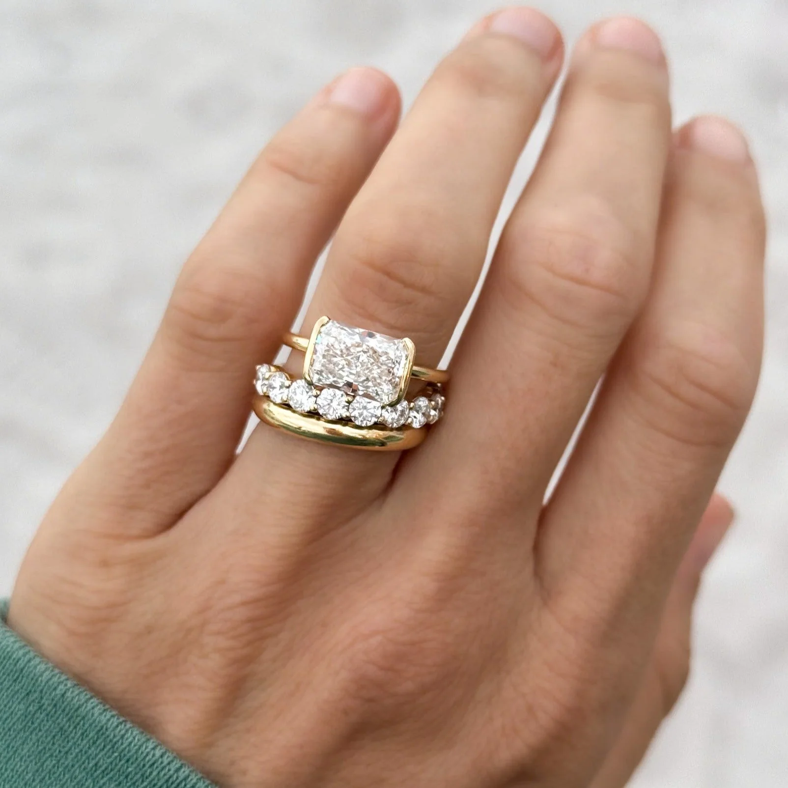 East West Half Bezel Solitaire Engagement Ring With Elongated Radiant Cut Diamond - Image 7